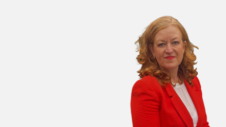 Profile photo of Michelle Atkinson wearing a red jacket.