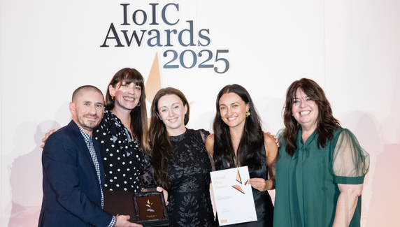 Five winners pose with award and certificate at IoIC Awards 2025.